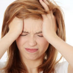 what causes headache behind eyes